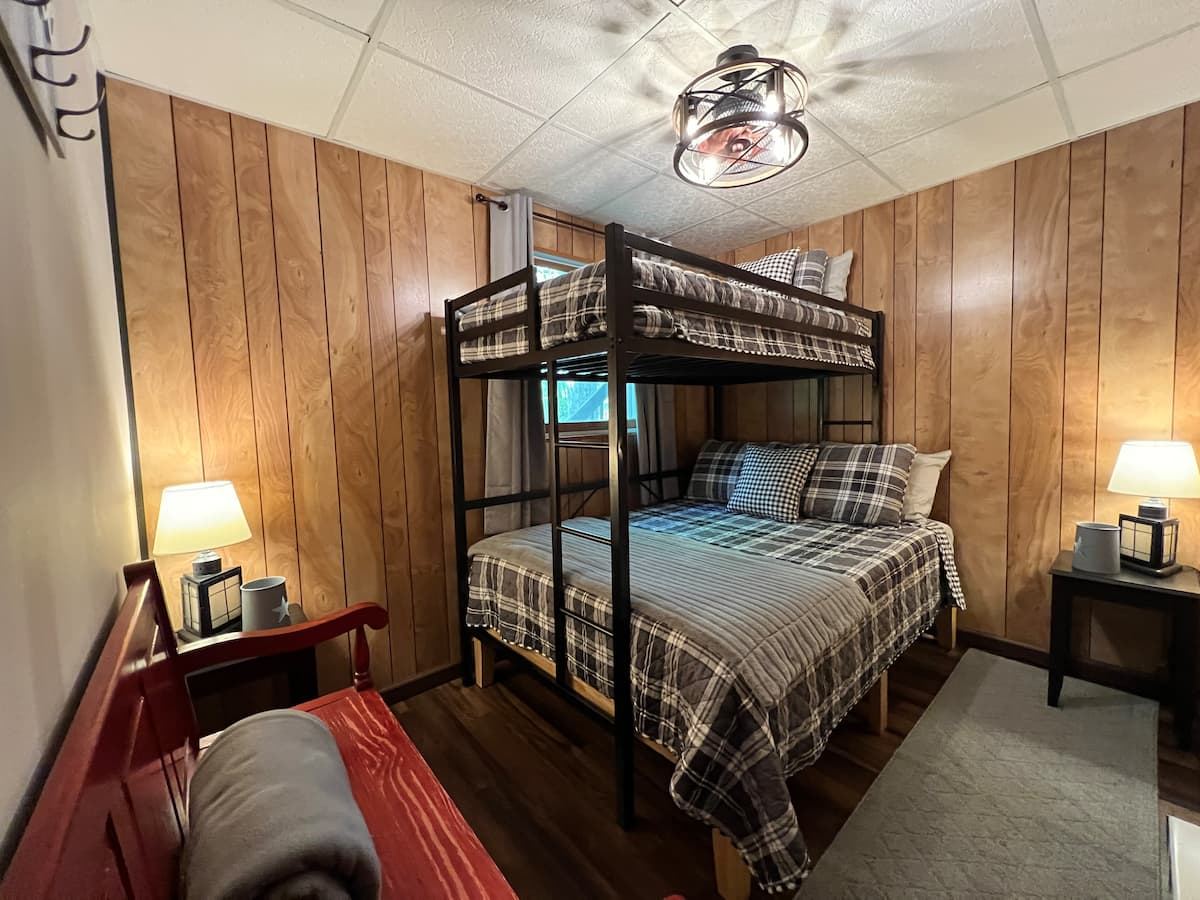 First-floor bedroom with a double bed and a twin bunk