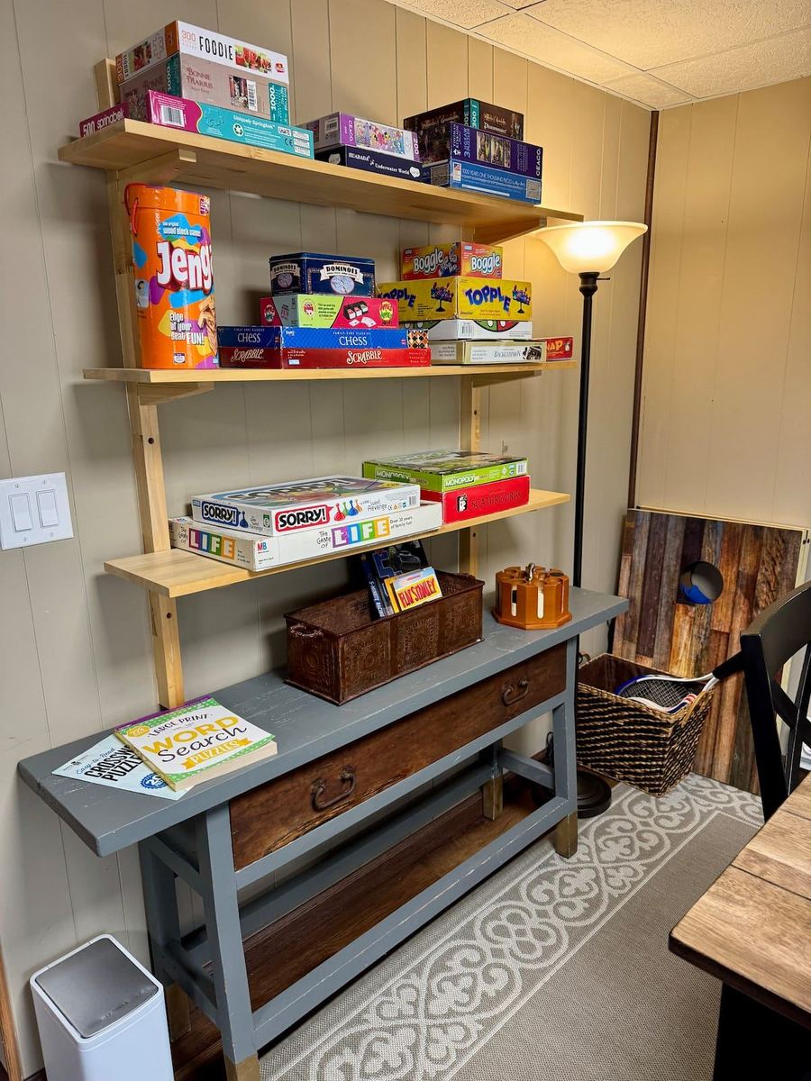 Shelf stocked with board games and books