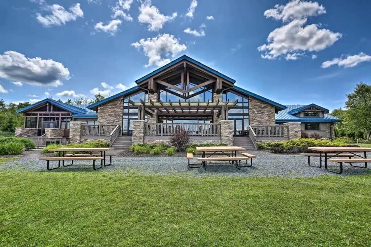 The community lodge with picnic tables overlooking the lake