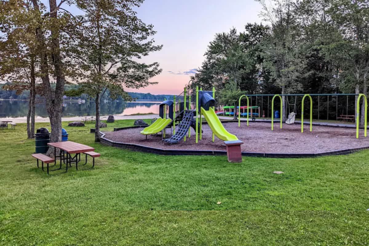 Lakeside community playground at dusk