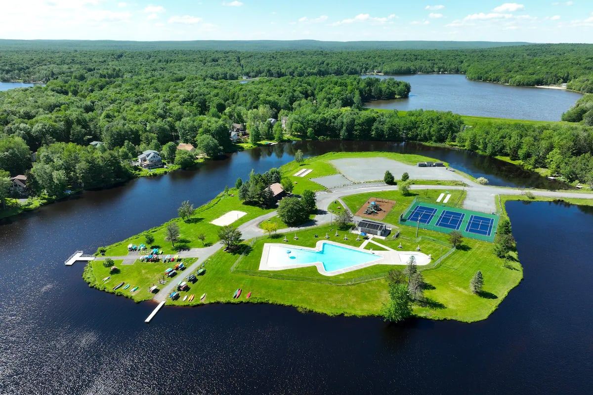 Aerial view of the Arrowhead Lake island pool and courts
